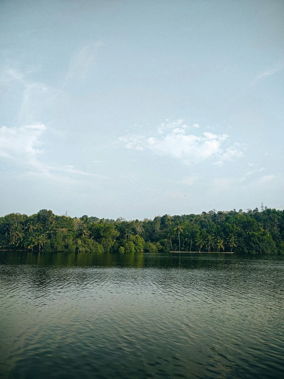 a couple of small boats floating on top of a lake