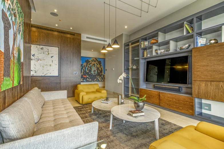 modern living room with wood shelving and artwork