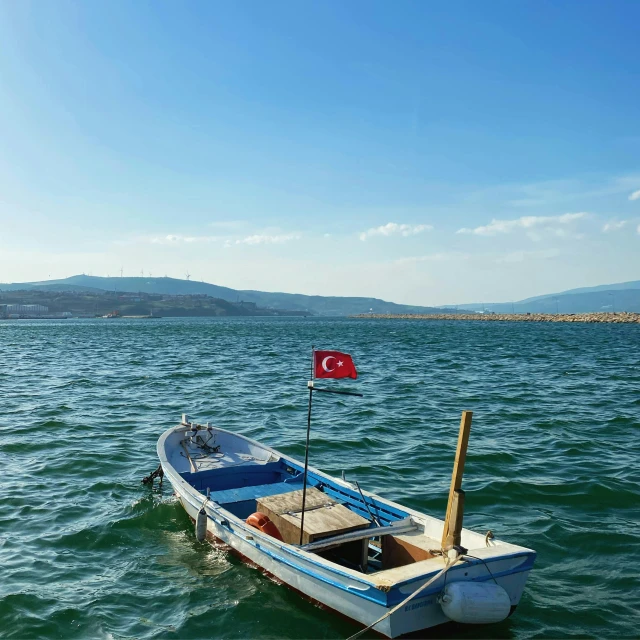 a small boat is out in the water