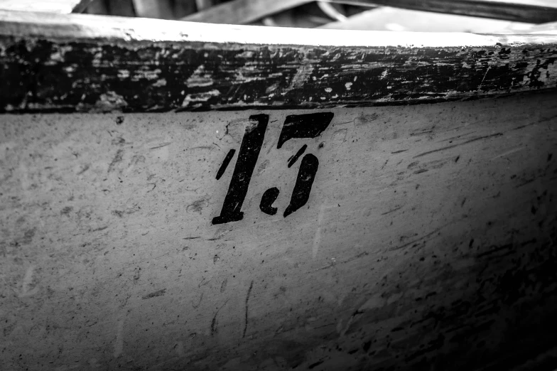 a number twenty fifteen engraved on a white boat