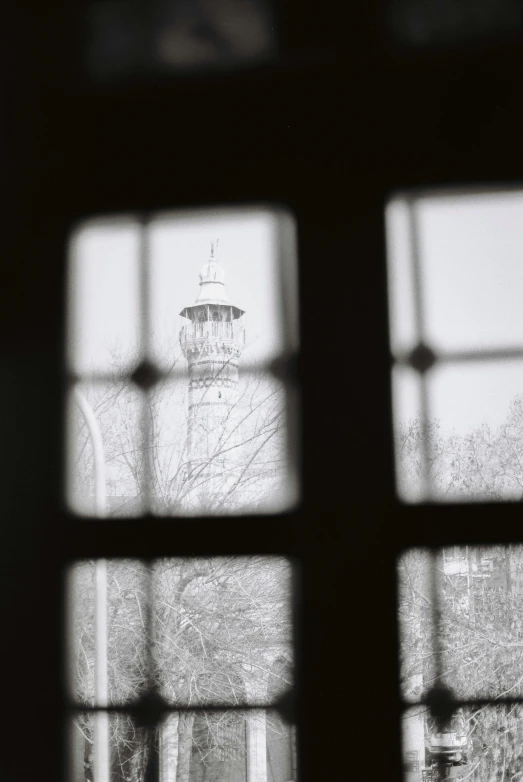 the view from inside of a window of a lighthouse tower