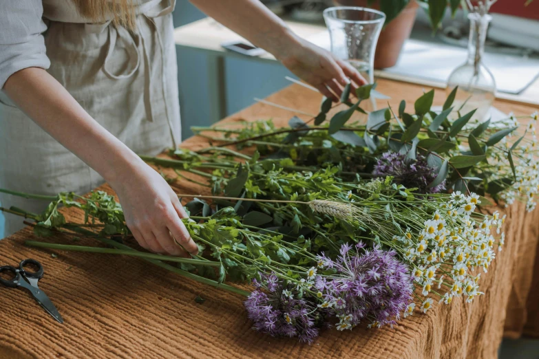 the woman has just begun her herb garden for her family