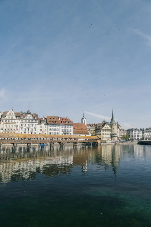 a view over the water from a bridge in a city