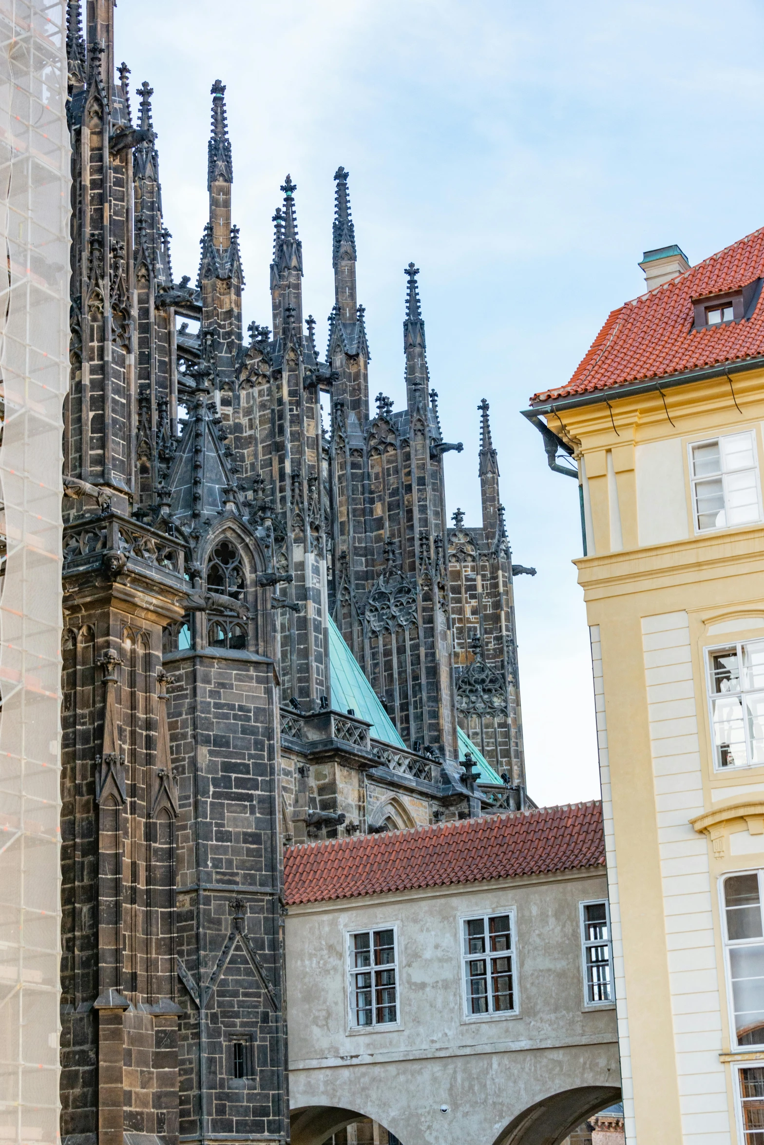 a cathedral with large windows on a cloudy day