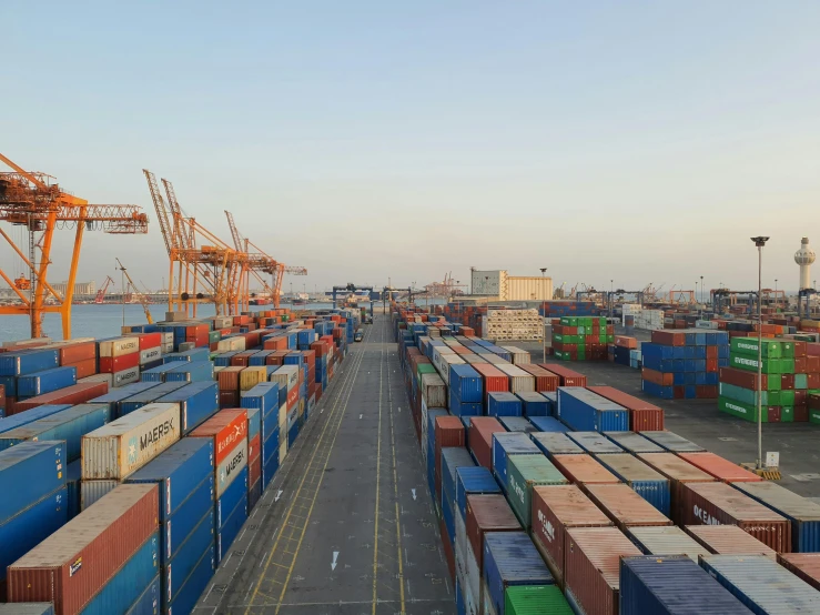 cargo containers are stored in a bay on the side of the ocean