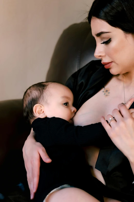 an image of a woman holding a baby