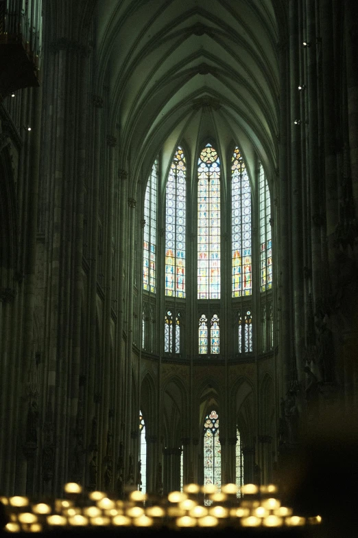 a cathedral with multiple stained glass windows and columns