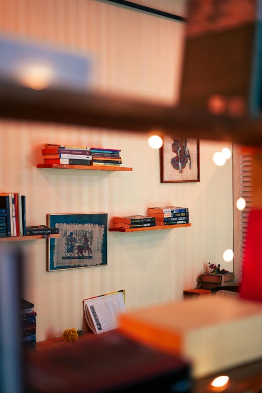 a row of shelves on the wall next to a lamp