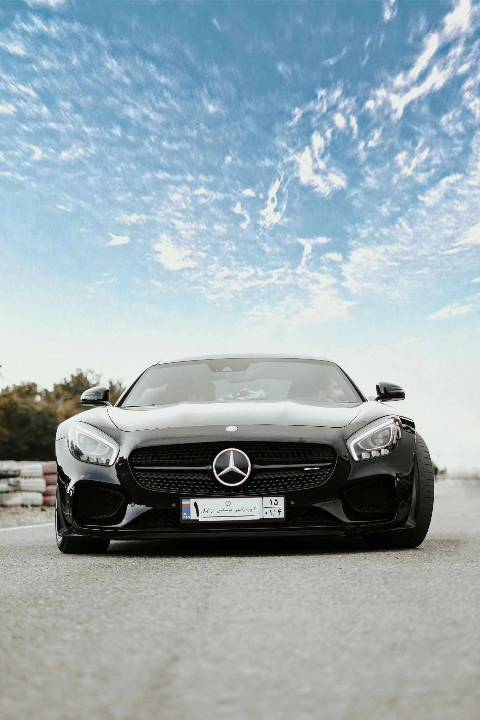 black mercedes benz car driving on the road