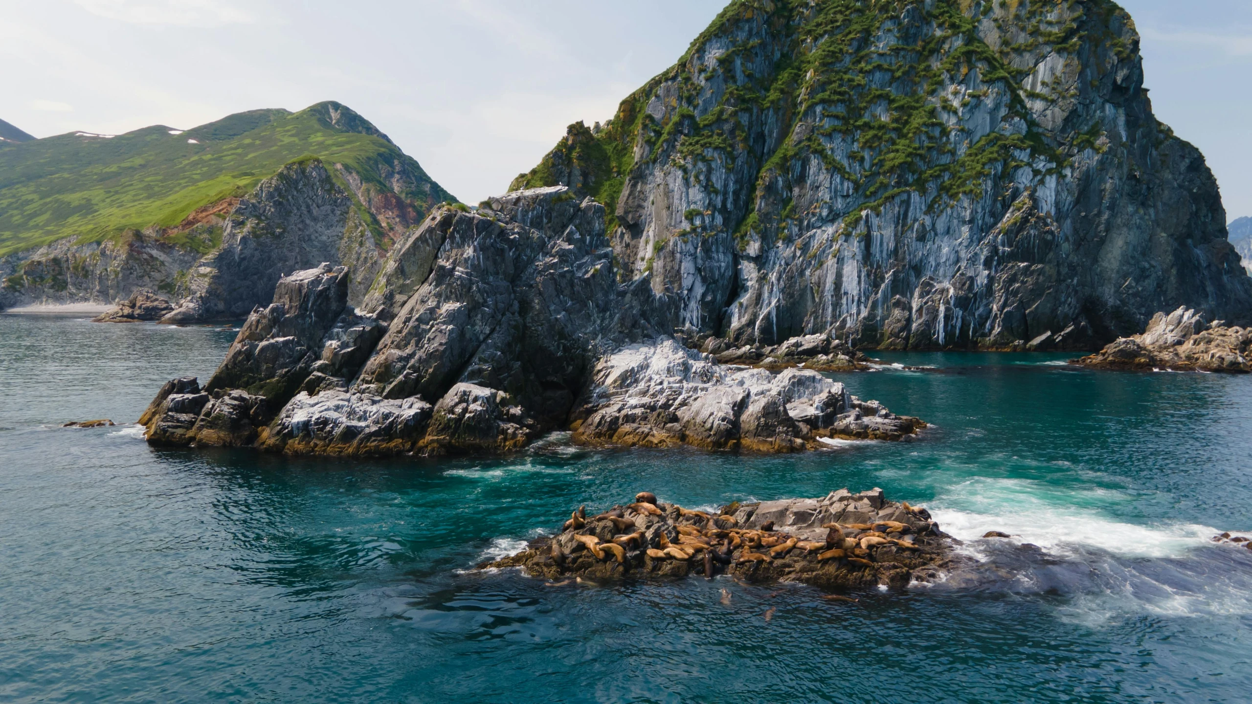 a body of water surrounded by rocky mountains