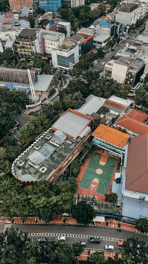 an aerial view of a city with buildings and trees