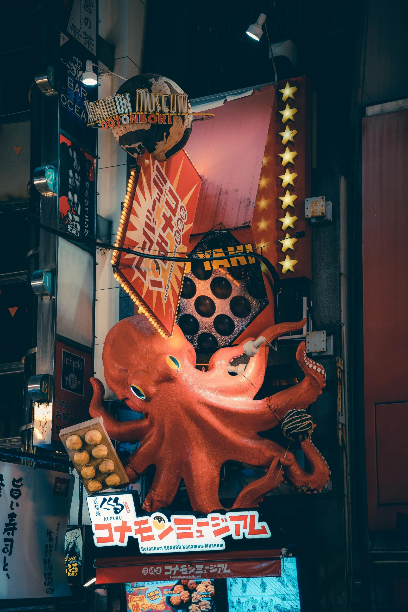 an octo statue is displayed in front of many decorations