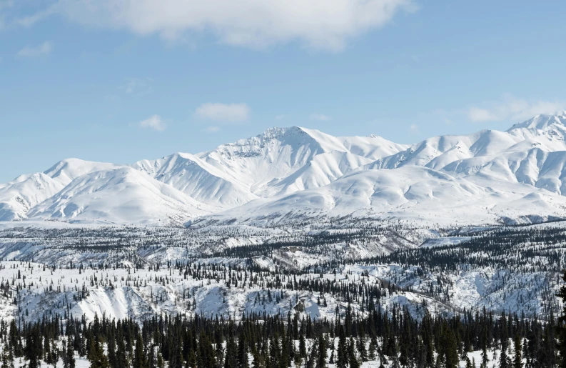 snow covered mountains are seen in this view