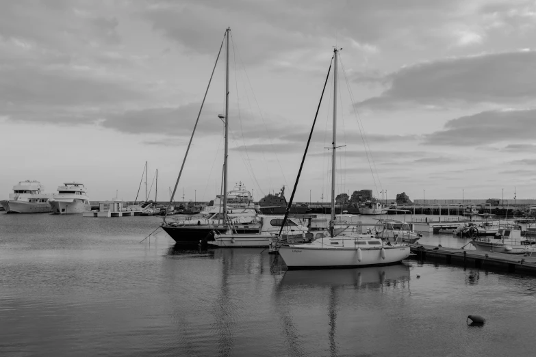 several boats parked in the water near buildings