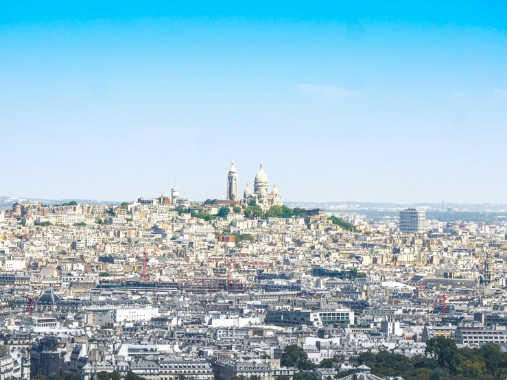 a city from a hill view looking down on the town