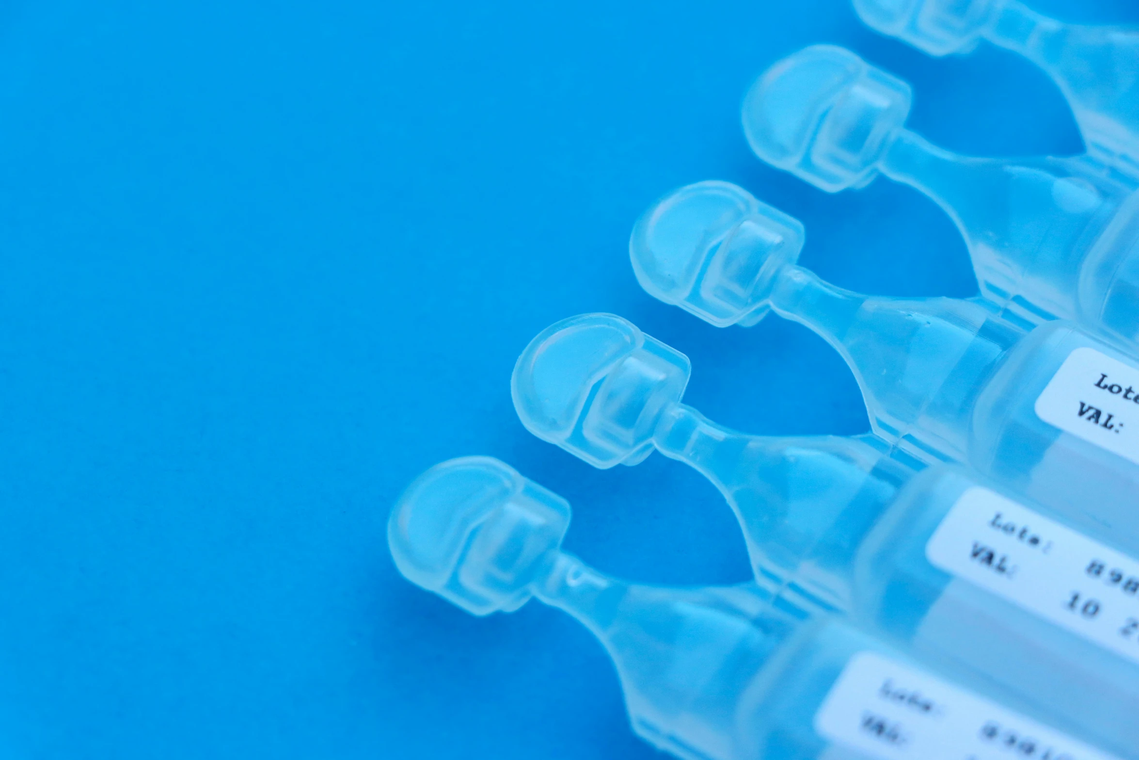 four medical syclots sitting on top of a blue table