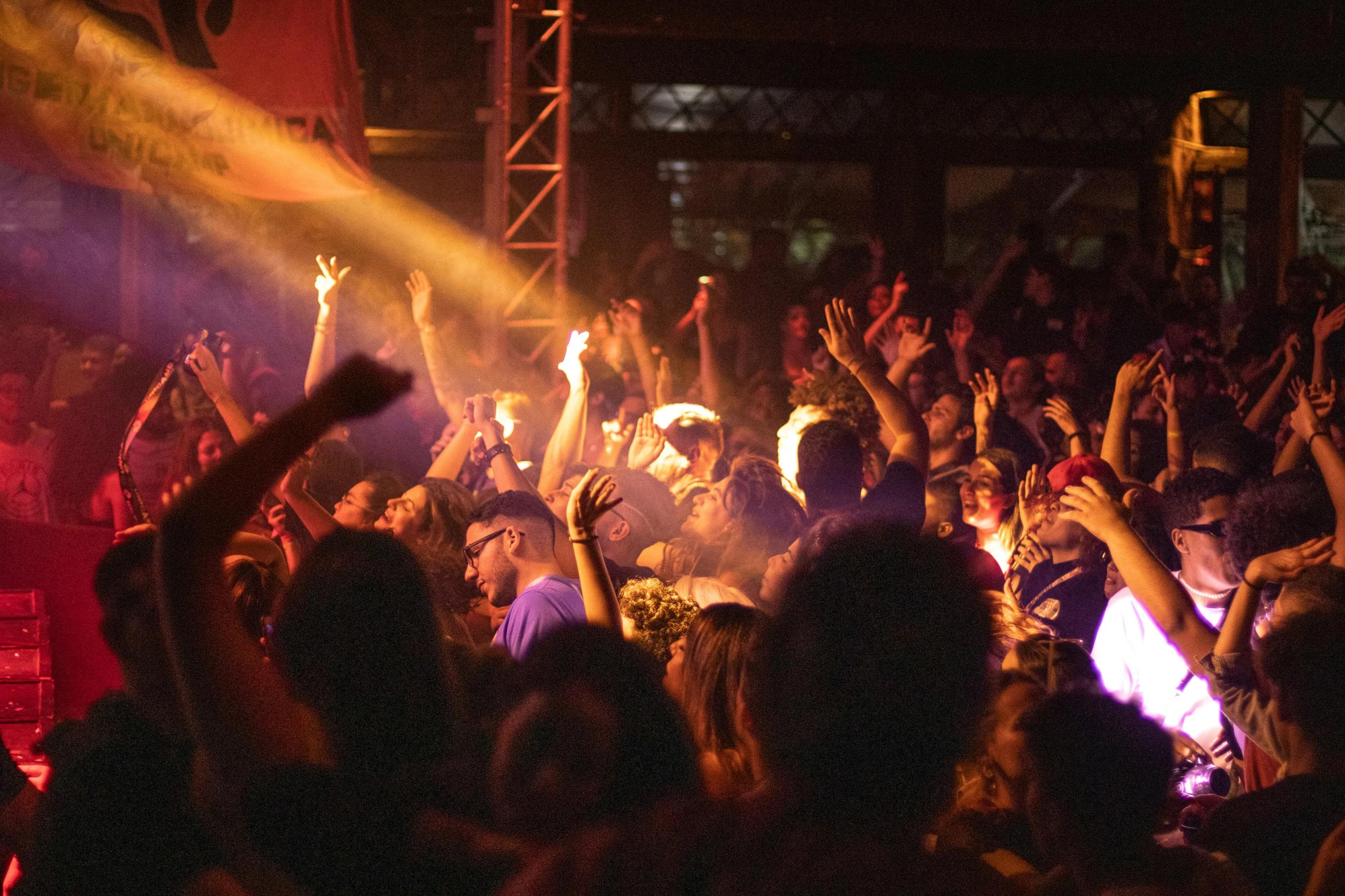 people are at the bar raising their hands to catch an event