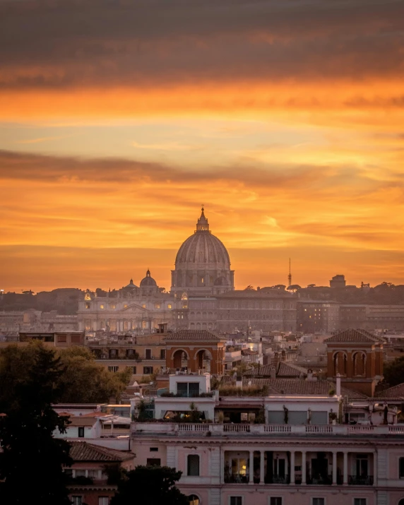 the skyline of paris against an orange sky