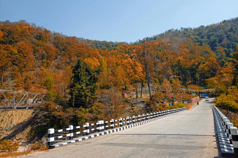 a road runs along the edge of the cliff