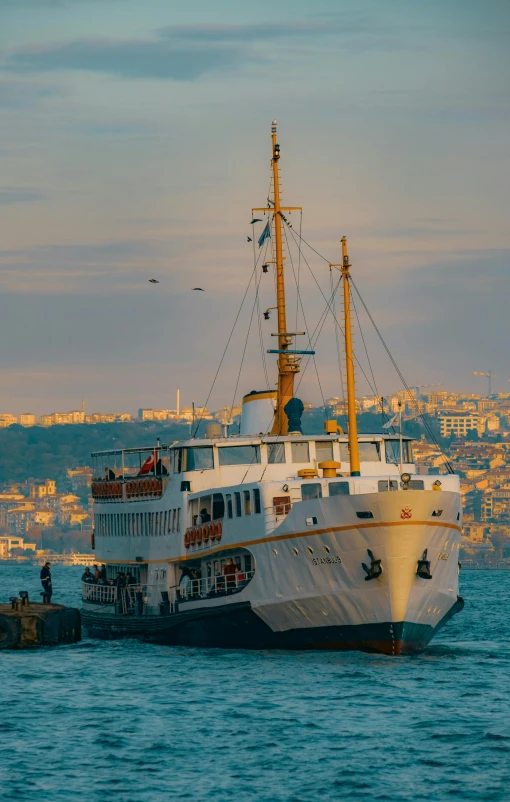 a ship in the water near some buildings