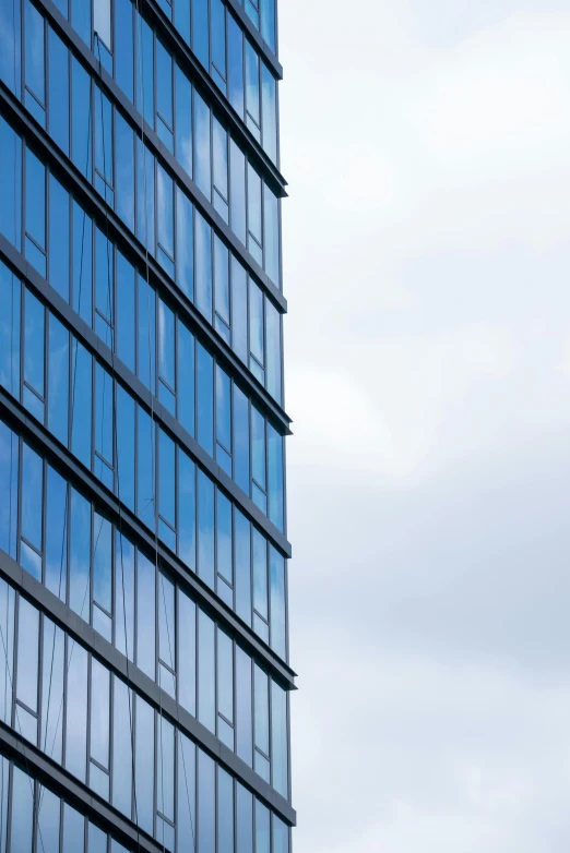 a tall building that has many windows near it