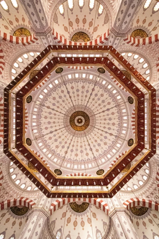 an interior ceiling has designs made in the same style and colors as the other