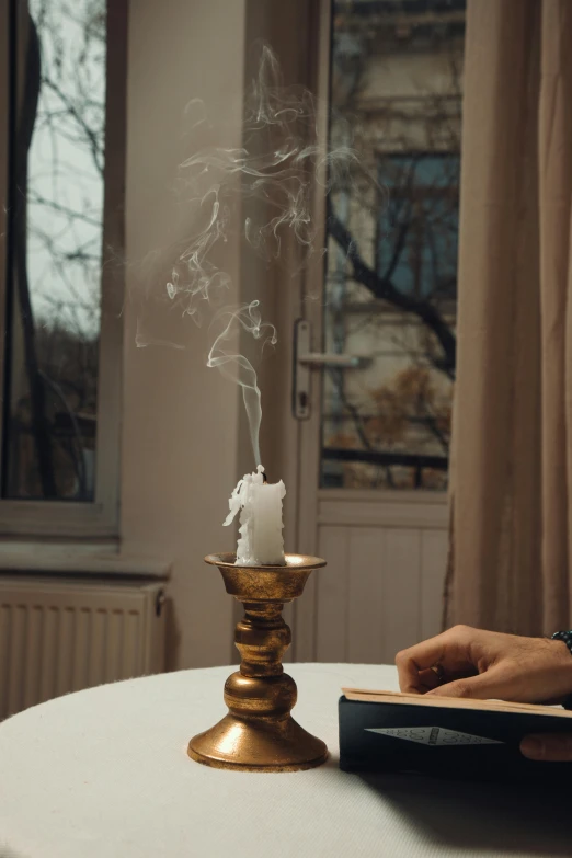 the candle has smoke coming out of it