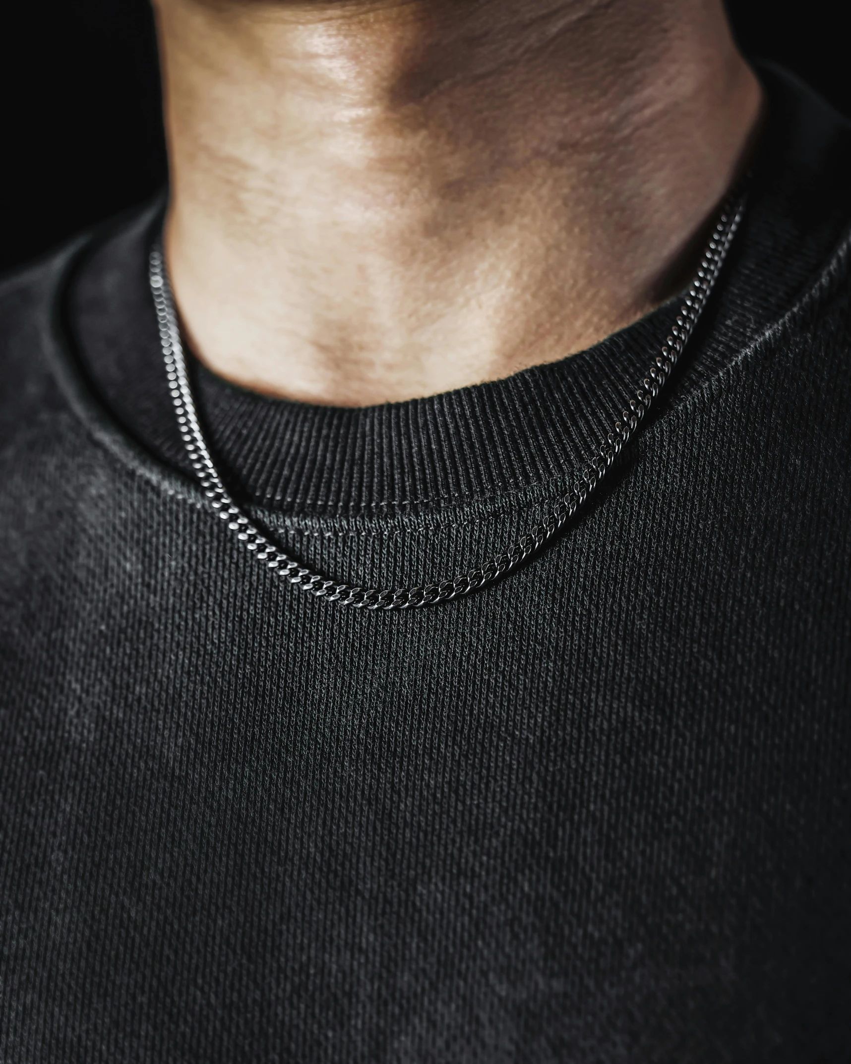 a close up of a person wearing a black shirt