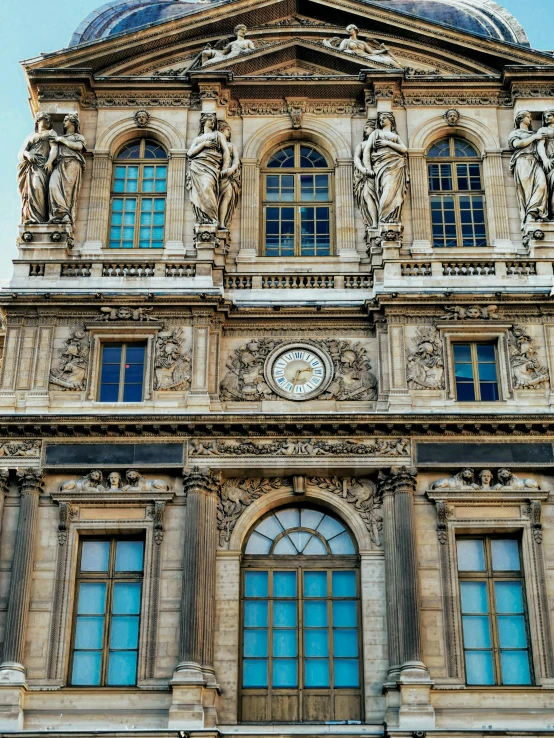 old style architecture with two large windows and a clock tower