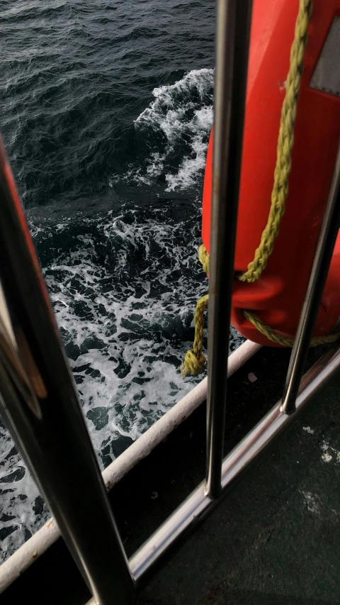 view from the side of a boat with a life preserver