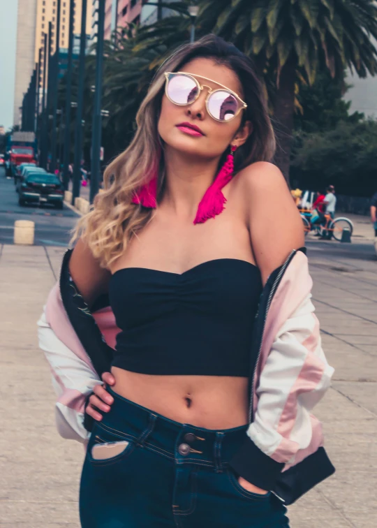 a girl in black clothing and some sunglasses