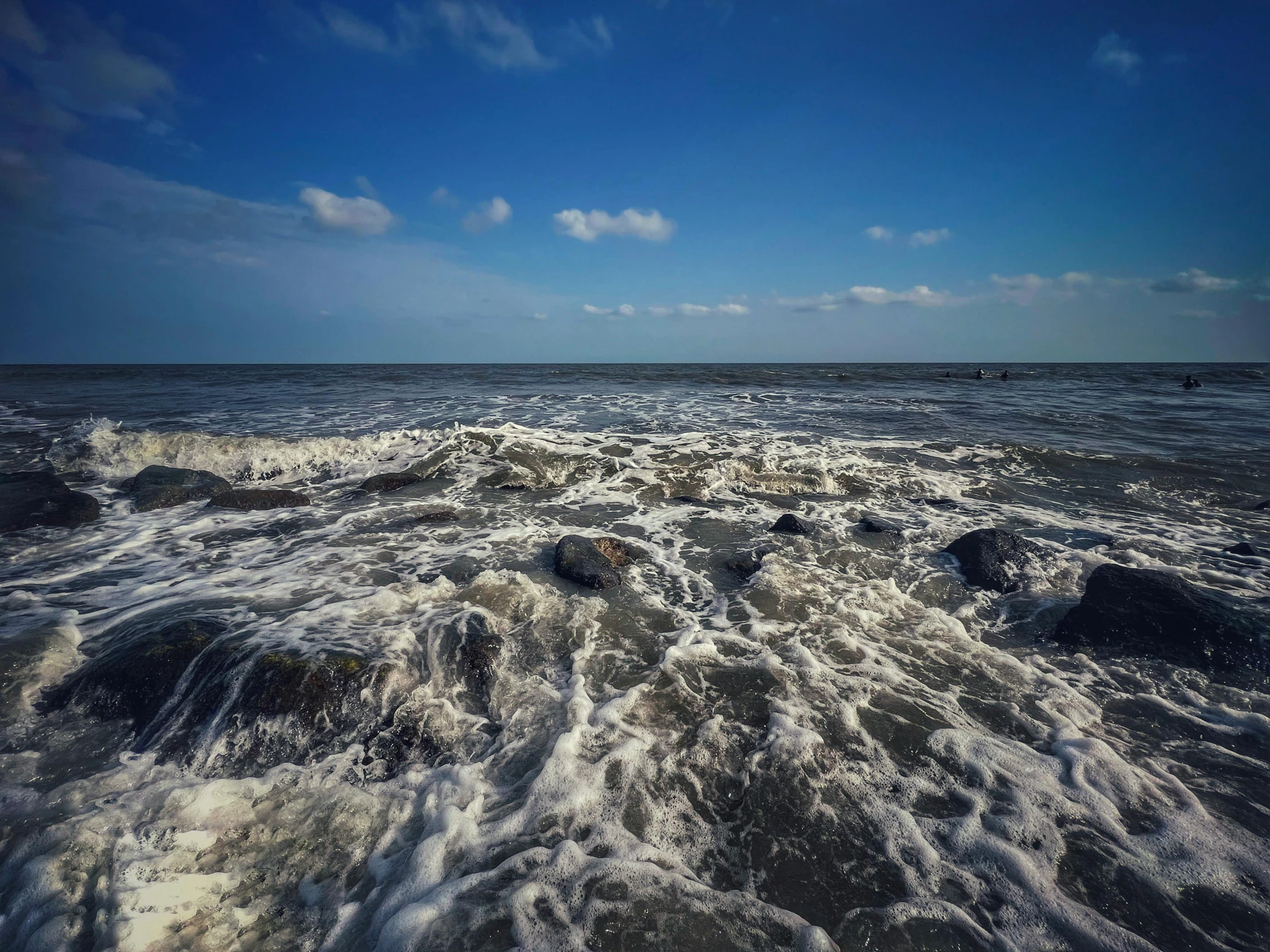 a large body of water surrounded by rocky shores