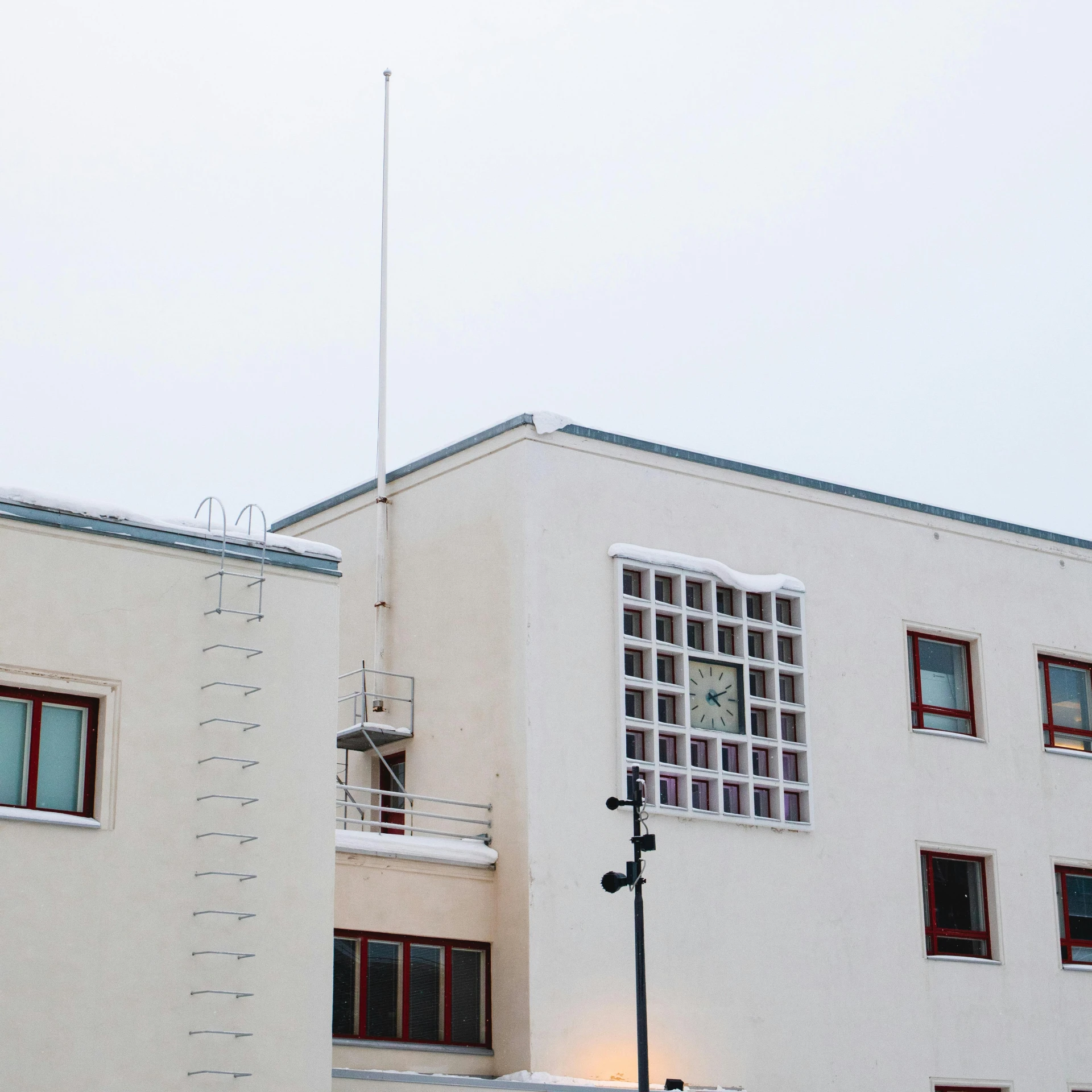 an image of the back side of a building with the top of it showing a clock