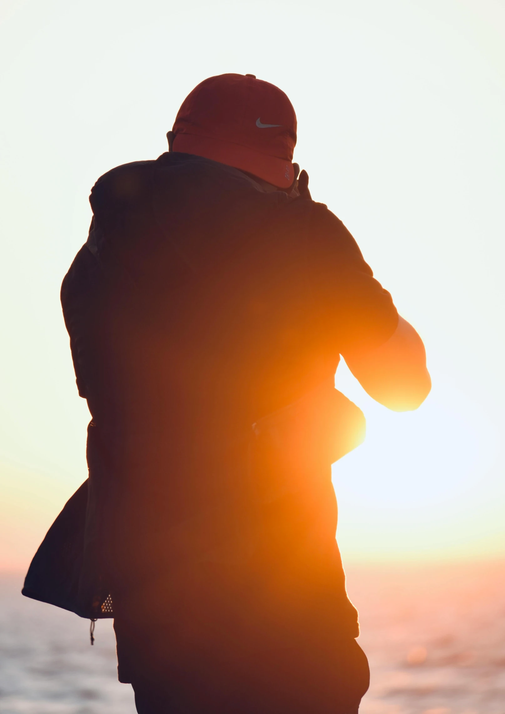 a person standing on top of a beach in the sun