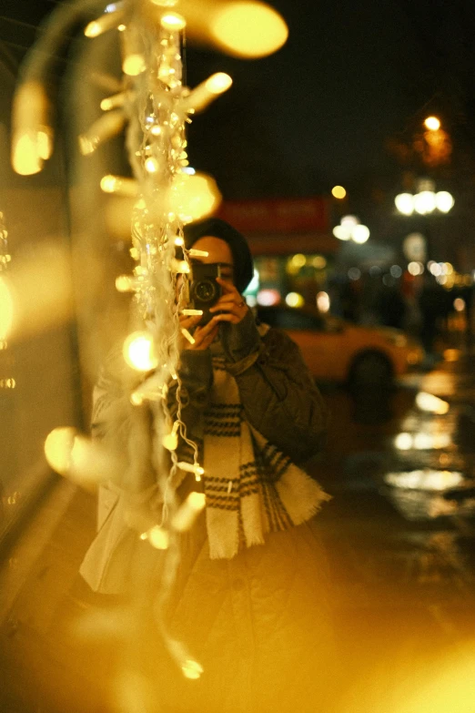 a woman is taking pictures of the street outside her store