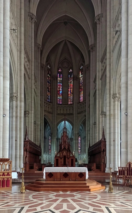 an empty church with tables and benches