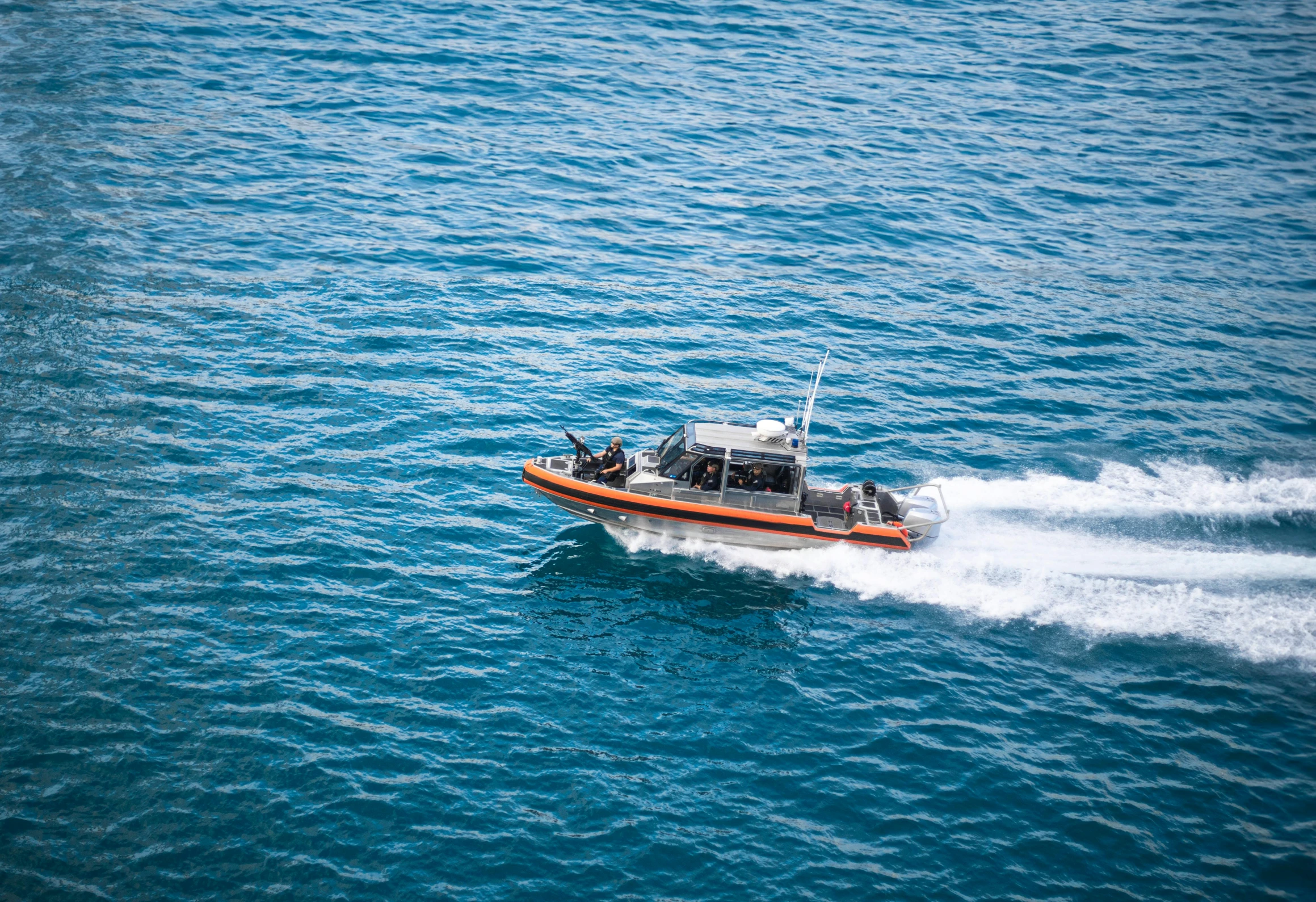 a boat traveling through the ocean on water