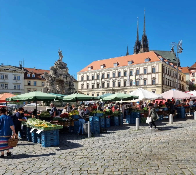 a city street filled with lots of people and vendors