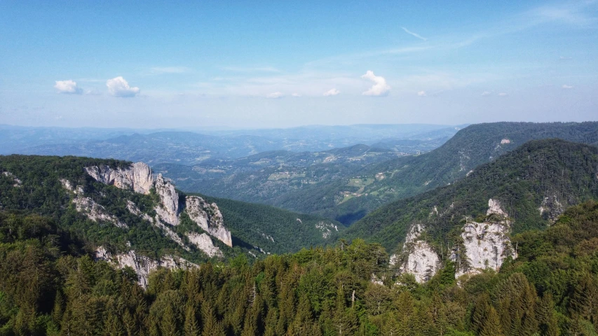 the view over a valley with a lot of trees