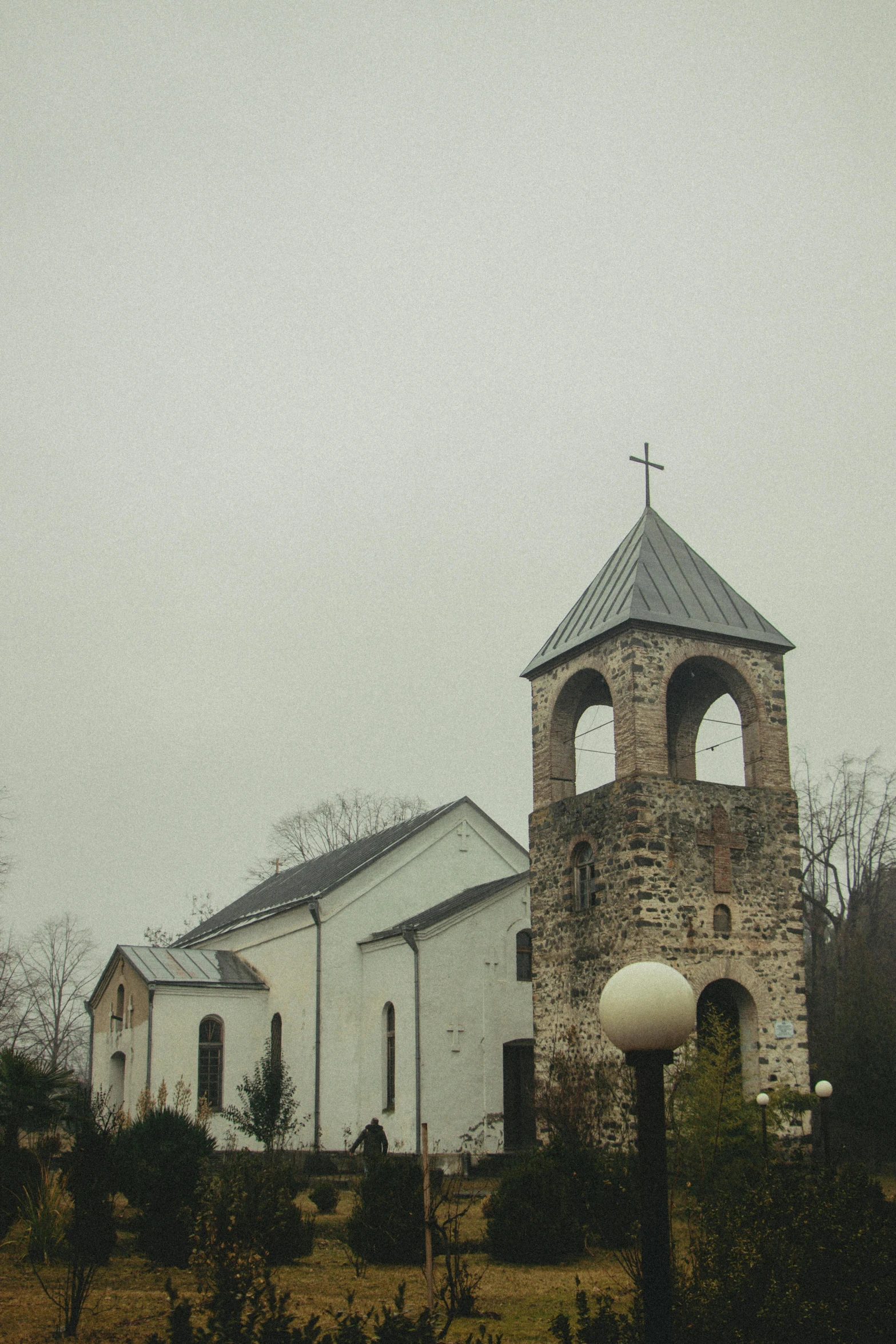 an old church with a cross and a cross on the roof