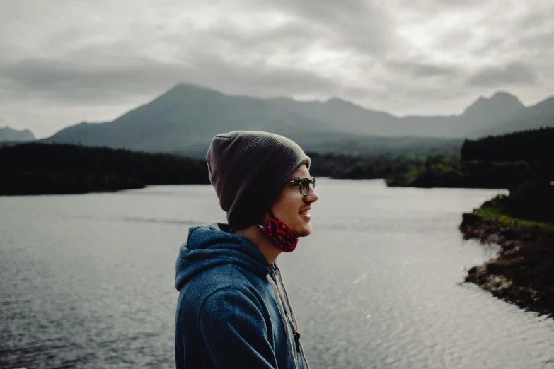 the girl is looking off at the water