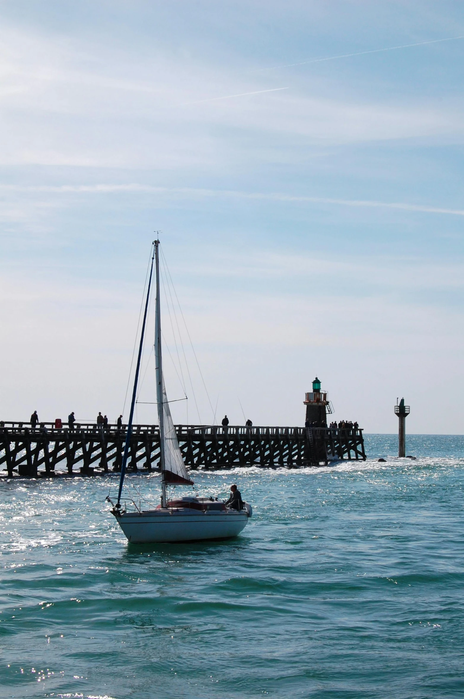 a sail boat that is in the ocean