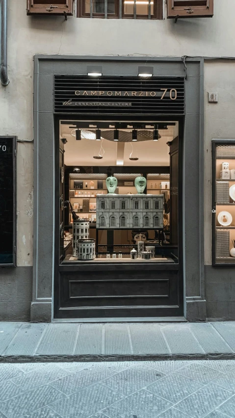 a storefront with an open window for jewelry