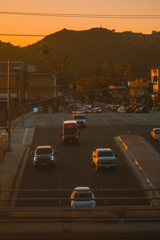 a group of cars driving down a street