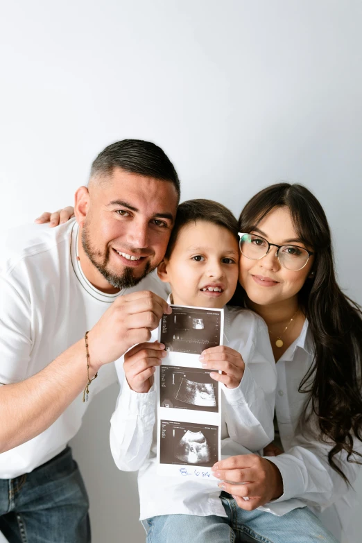 a man, woman and child posing for a po