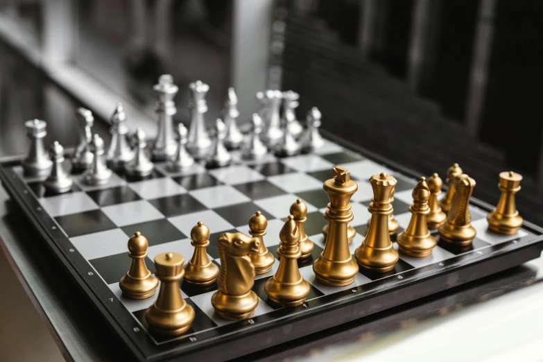 several ss and silver chess pieces on a tray