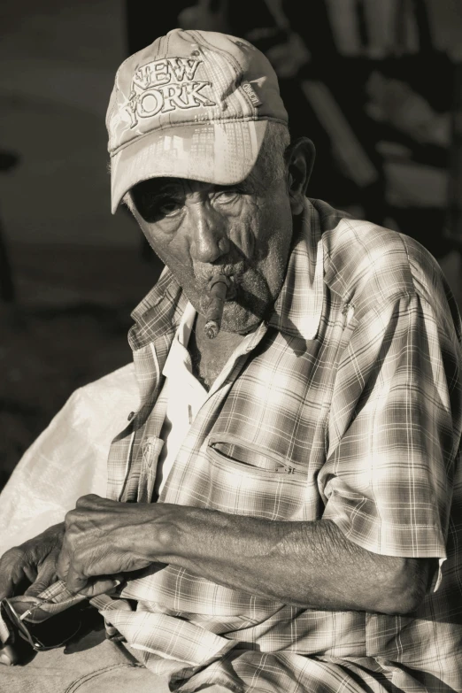 the old man is smoking a cigarette