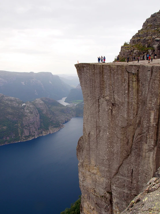 a couple on top of a high cliff