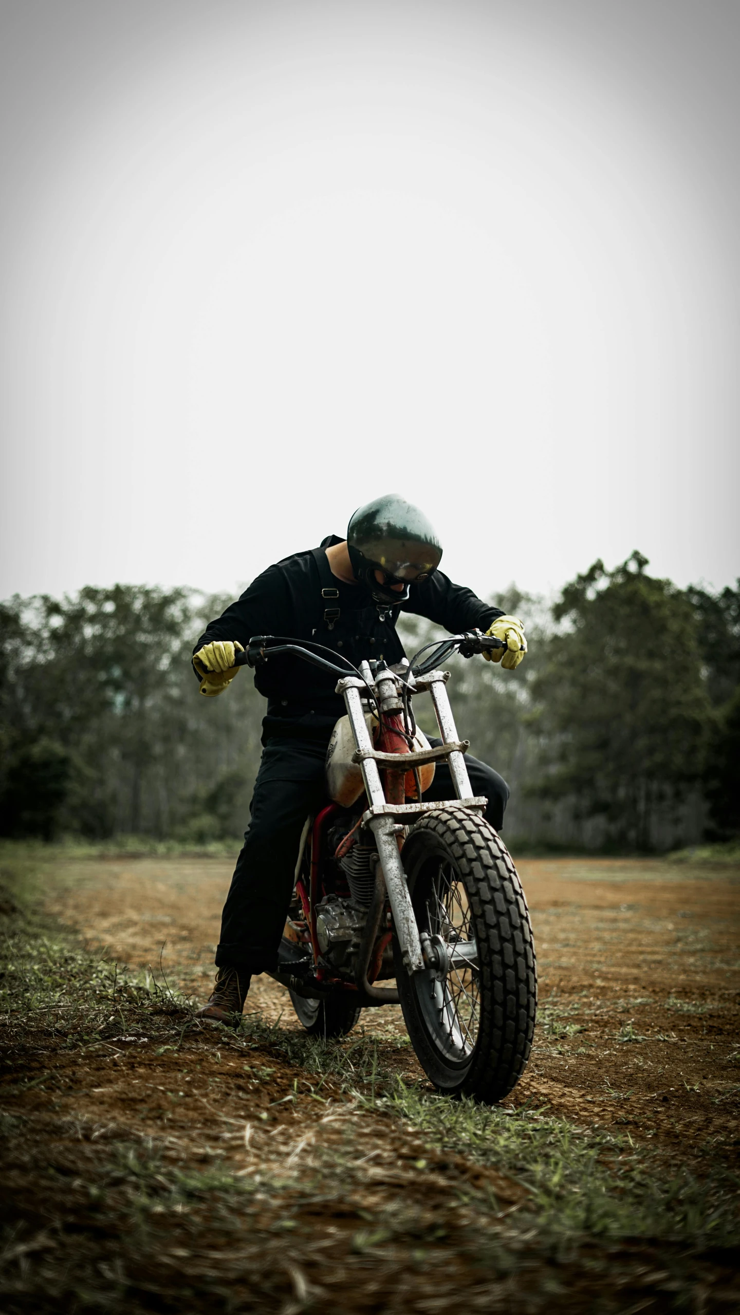 a man on a dirt bike is posing for the camera