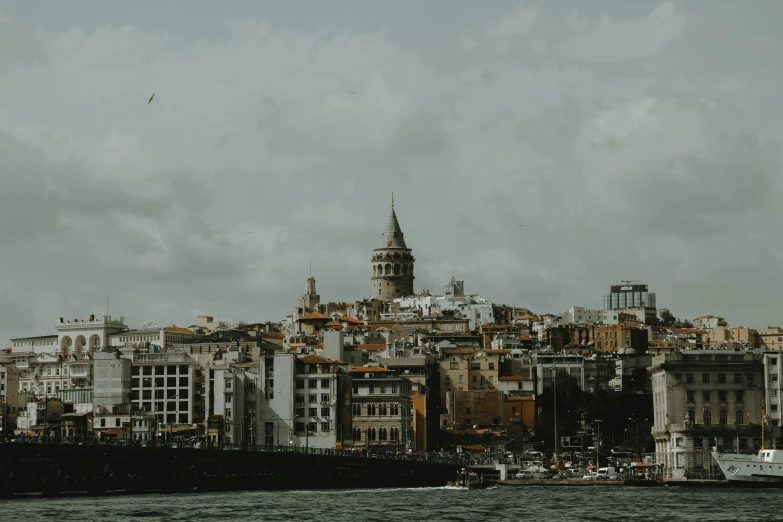 a large castle like building standing on the edge of a river